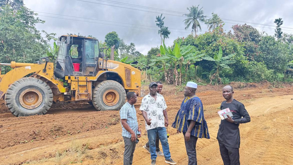 DISTRICT CHIEF EXECUTIVE AND COUNCIL OF STATE MEMBER INSPECT ONGOING ROAD PROJECT.